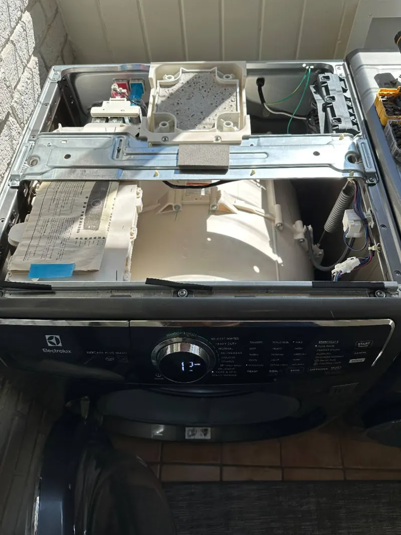 Electrolux washer with the top panel removed during inspection